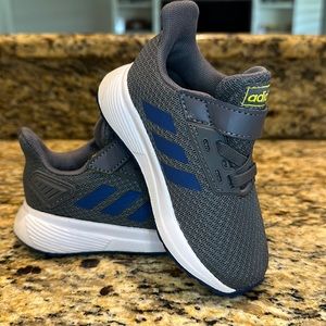 Toddler’s size 6 gray Adidas.